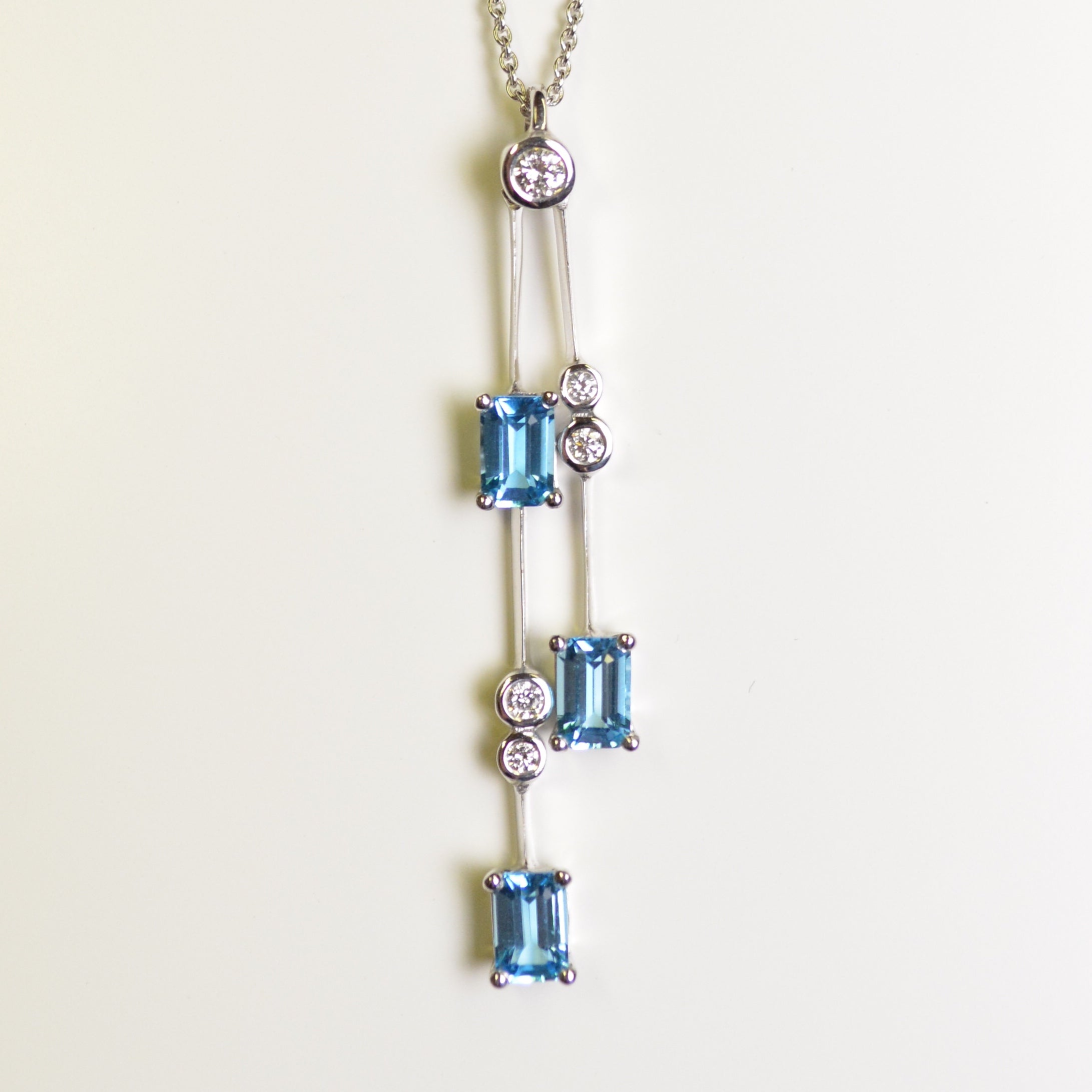 ER8820 Blue Topaz & Diamond Drop Pendant in 18ct White Gold